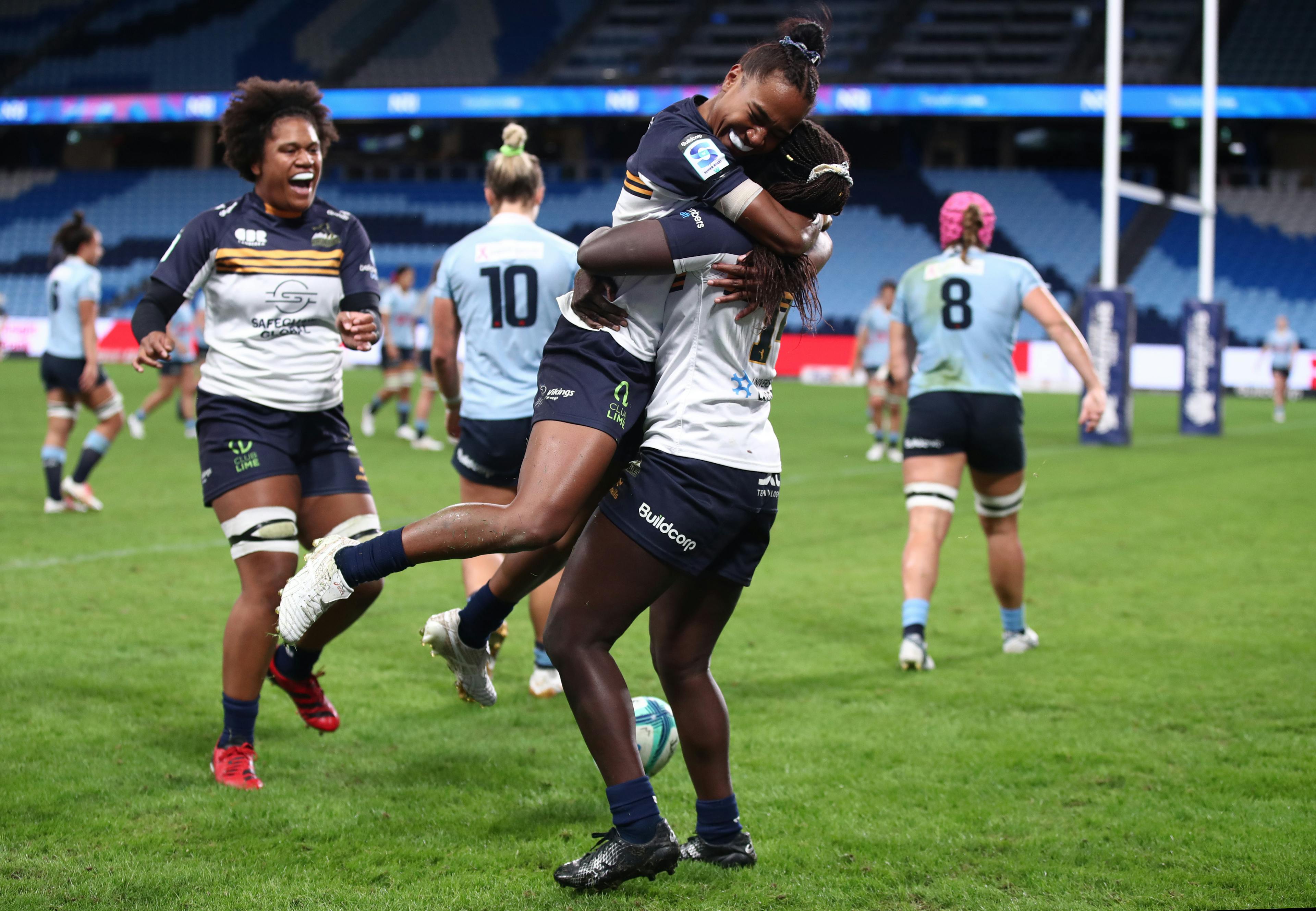 Biola Dawa celebrates with Kolora Lomani after a try in the Super Rugby Women's Semi Final.