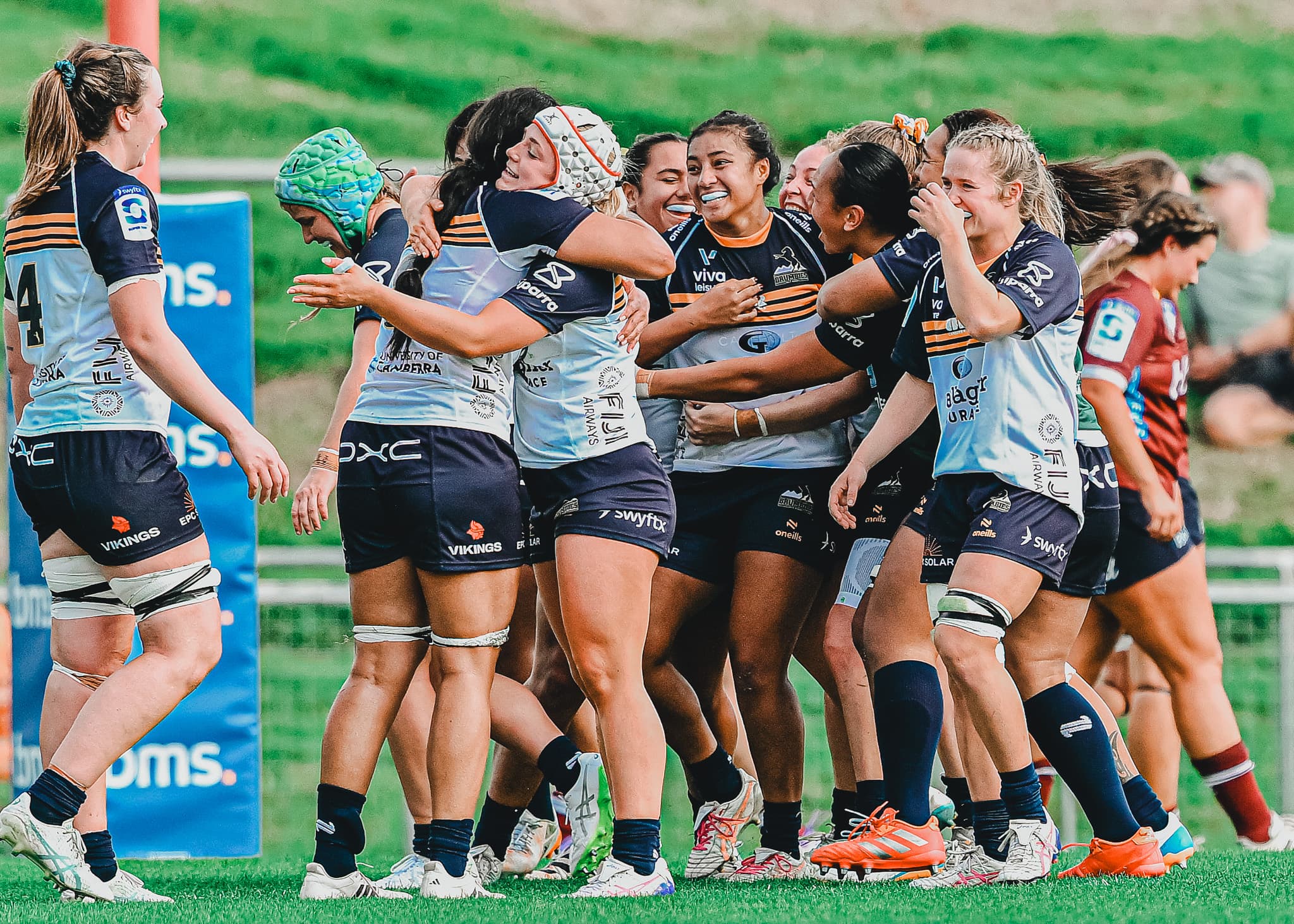 Faitala Moleka surrounded by her team after sealing the ACT Brumbies victory over the Queensland Reds. | Image by Getty Images.
