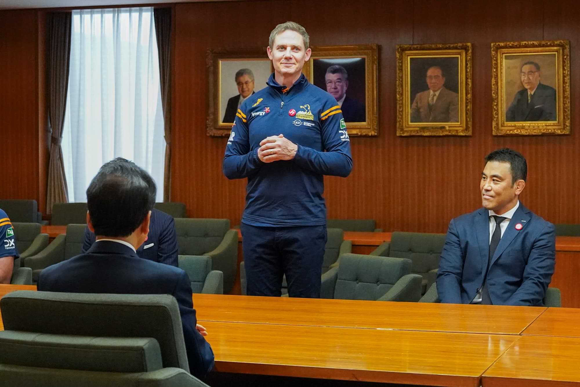 Brumbies Head Coach Stephen Larkham addresses attendees at Sapporo City Hall.