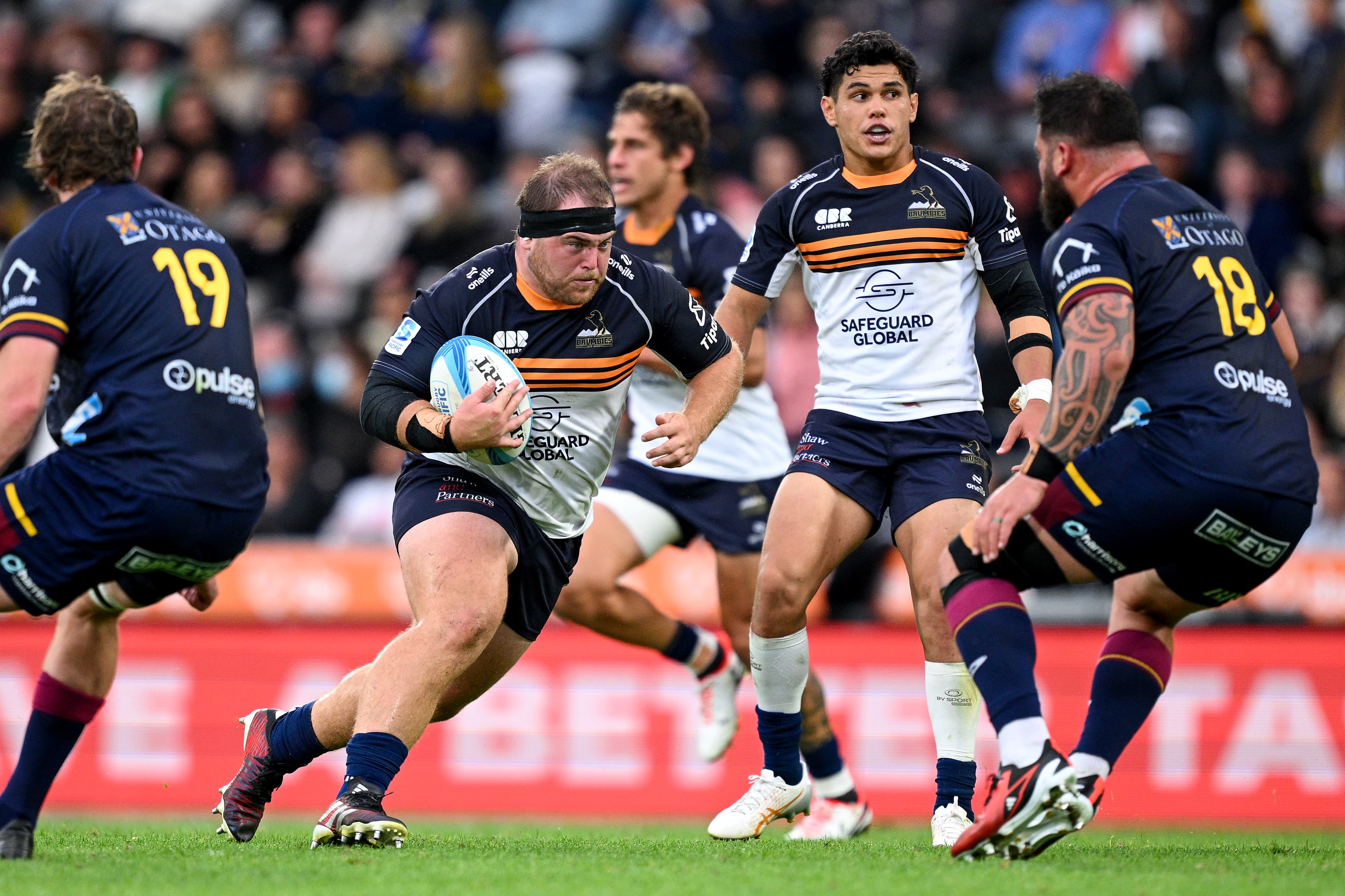 Rhys van Nek carts the ball up against the Highlanders.