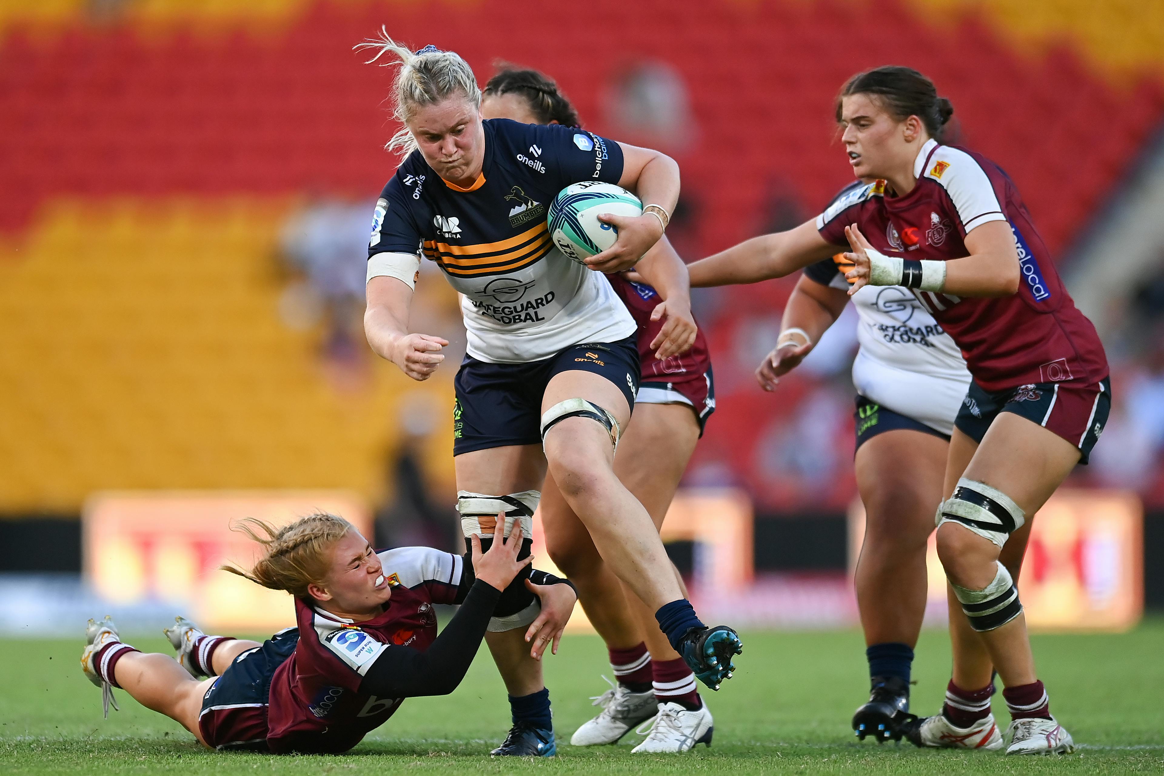 Kate Holland takes a strong run during the Brumbies win over the Reds.