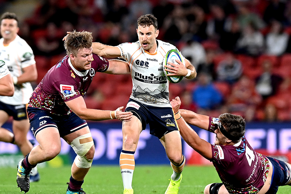 Nic White brushes aside the Queensland defence. Photo: Getty Images