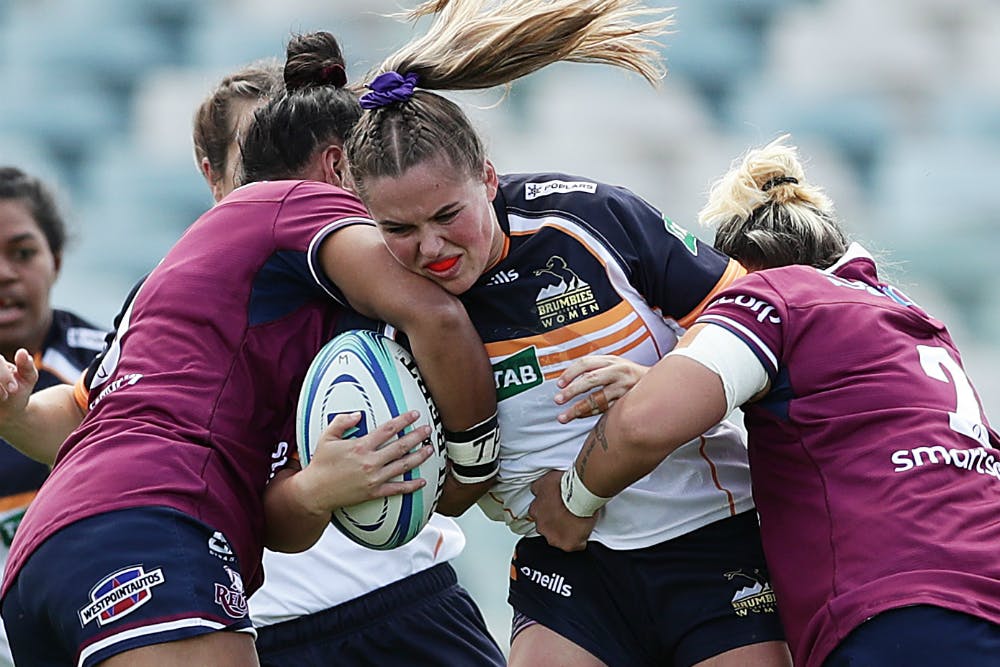 Ainsley Scrivener battles her way through the Queensland defence. Photo: Getty Images